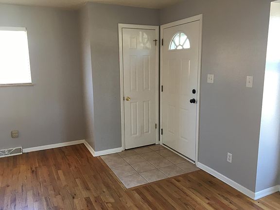 interior walls are contemporary soft grey colors with white woodwork