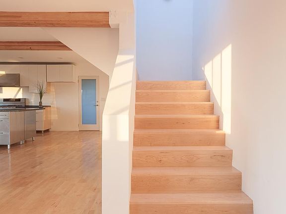 Generous staircase with central landing and beautiful skylight