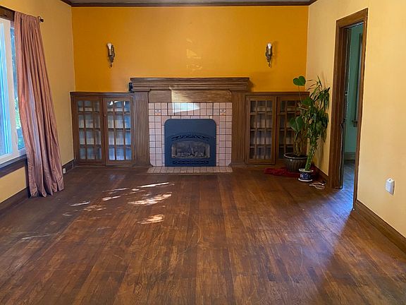 Living room with electric fireplace and built ins