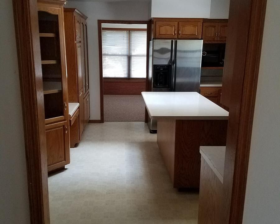 Kitchen w view into Dining Room