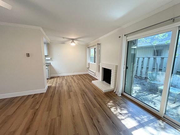 Living area, fireplace and dining area