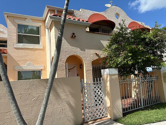 Front entrance view after outside of building was painted and we installed upgraded hurricane impact windows