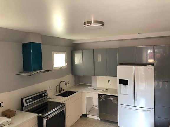 Kitchen with stove refrigerator, microwave, and dishwasher