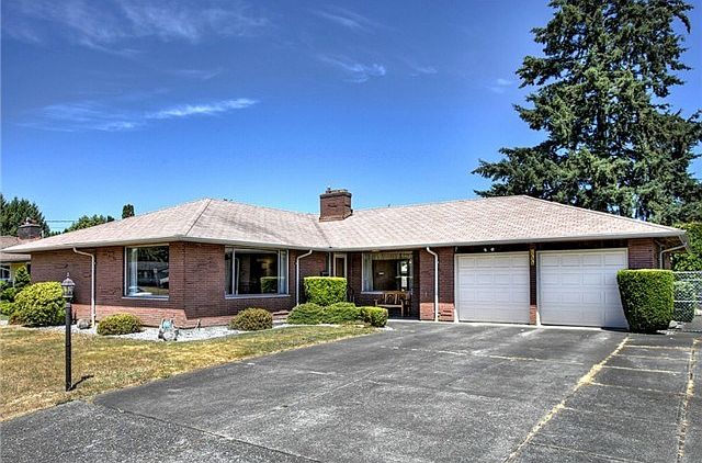 Amazing brick rambler with a basement and attached two car garag