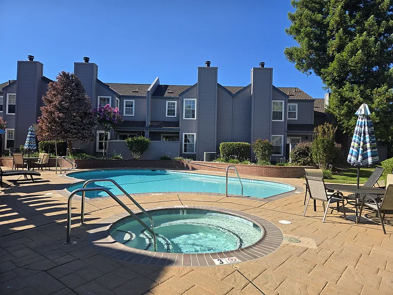 Relax and unwind at the community's sparkling swimming pool and spa, surrounded by beautifully maintained landscaping and mature shade trees.