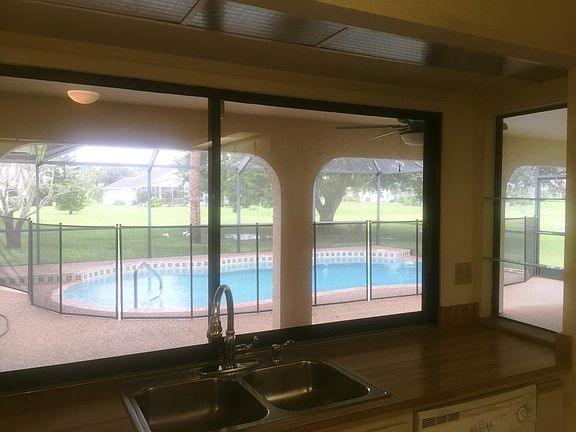 view of pool and lanai from kitchen