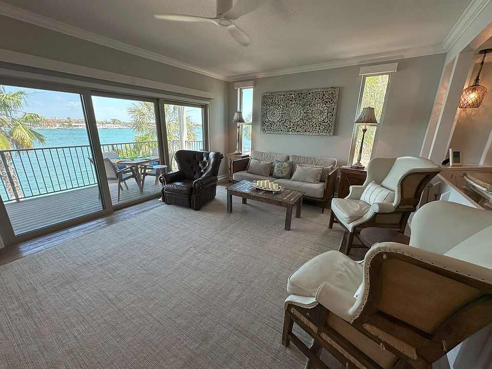 Living Room with Balcony overlooking Blind Pass intercoastal waterway