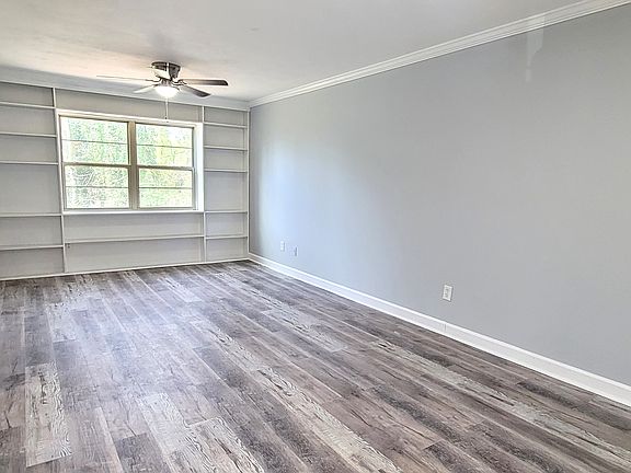 Charming, remodeled family room with custom built-in bookcases