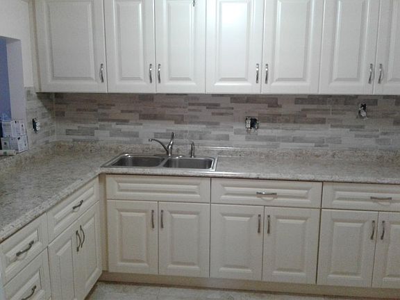 All brand new kitchen cabinets (with a lot of storage) and counters.