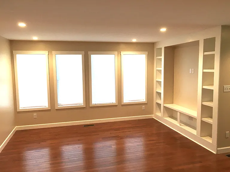 Living Room with tv nook and bookcases