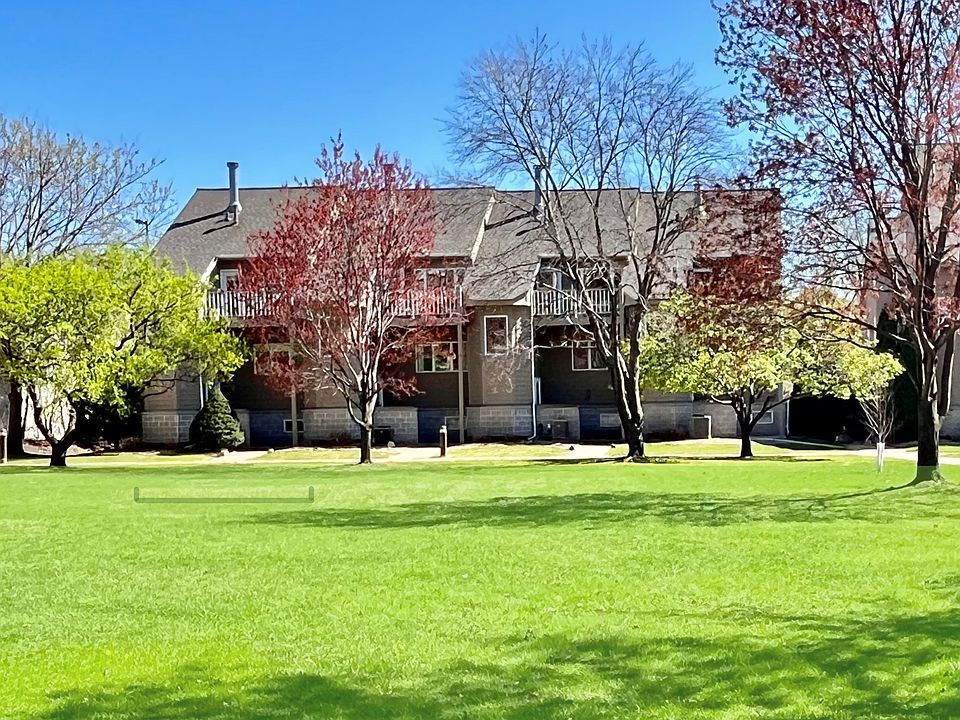 Townhome faces lush courtyard in private upscale community in the heart of Uptown