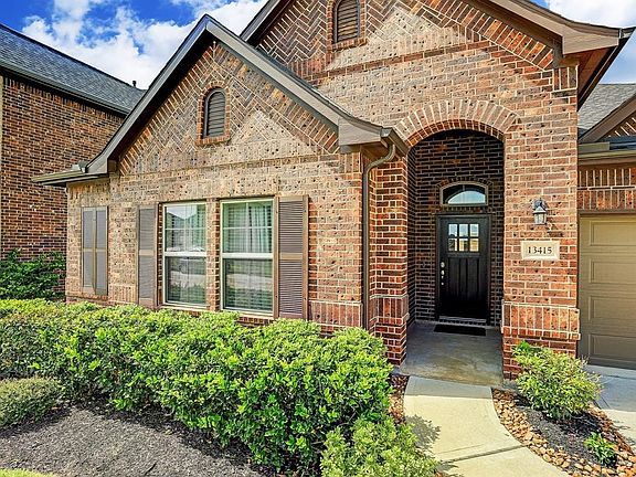 Front Door with a traditional stained wood door.