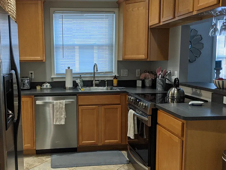 Kitchen - dishwasher has been updated after this pic. Open area to the Dinning room.