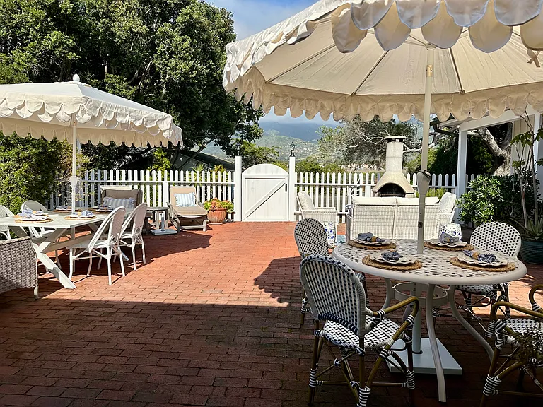 Front courtyard with dining for up to 10. Mountain views.
