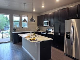 Kitchen- washer, electric stove, fridge, microwave, island