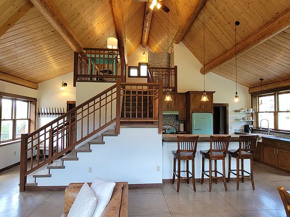 Open Living / Dining / Kitchen with BIG mountain views in each window