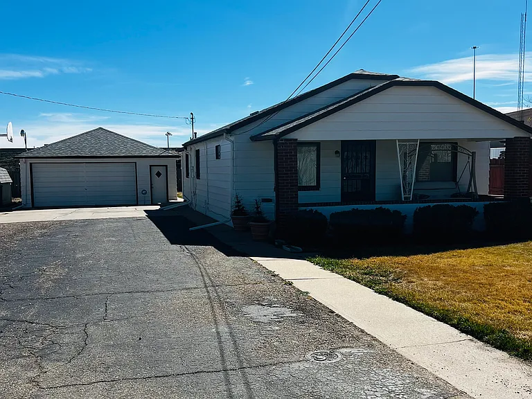 Front of house, driveway and garage