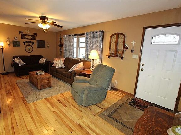 LIVING ROOM: REAL HARDWOOD FLOORING