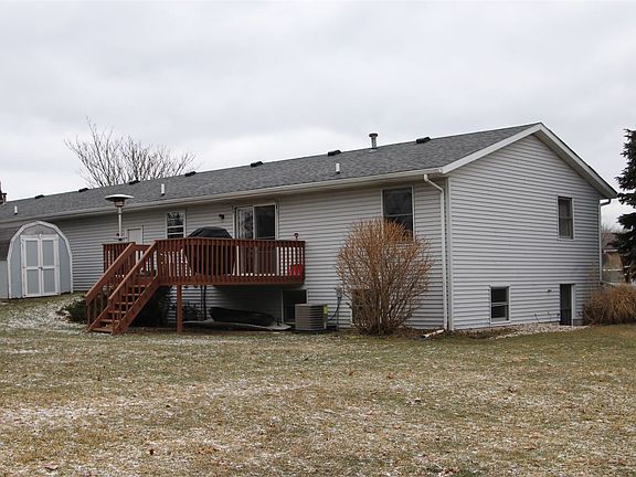 Back yard with deck off of the dining room. Small storage sh