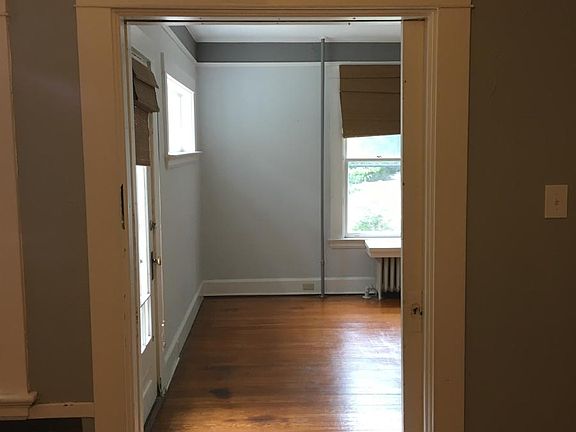 Bedroom to Living Room with original over-sized pocket door