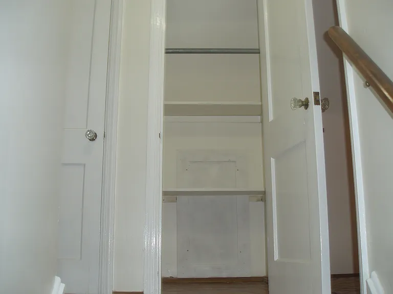 The top of stairwell leads to a hallway with 2 large closets for the bedrooms on either side of the hallway.