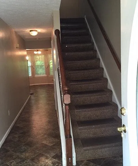 Center hallway with stairs to 2nd floor.
