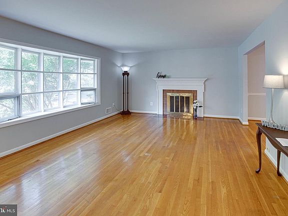 Expansive living room with wood burning fireplace