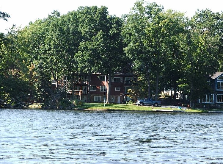 located on the Main chain of lakes on the Portage Lakes at the end of a private island