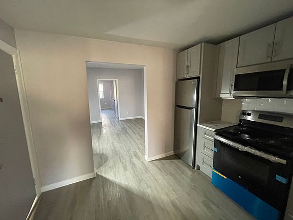 Kitchen opening into living room.