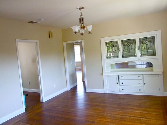 Separate dining room with built-in cabinet