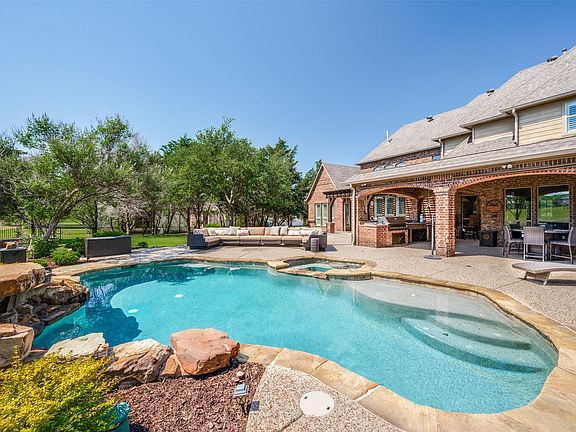 The sparkling pool is ready for summer - whether you are inviting friends or enjoying a quiet weekend, this backyard provides everything you need to relax and unwind