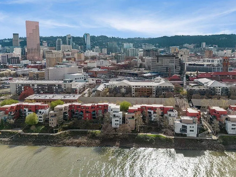 This unit faces the river with great view from living room and deck and is located approx middle of the complex. NO obstructed views from the deck/living room...Mod and Max Arena across the way!