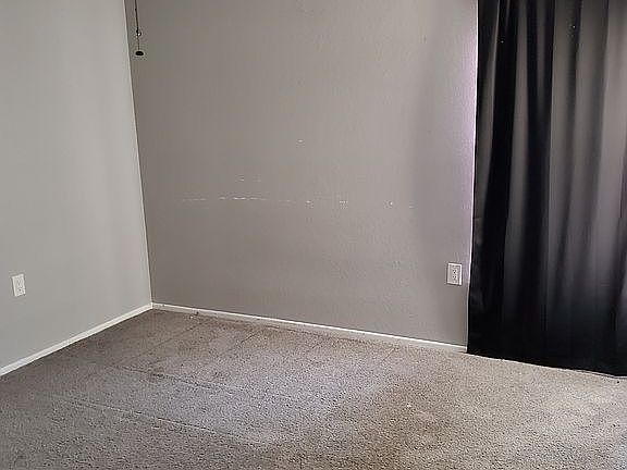 Upstairs bedroom has a balcony in a large closet