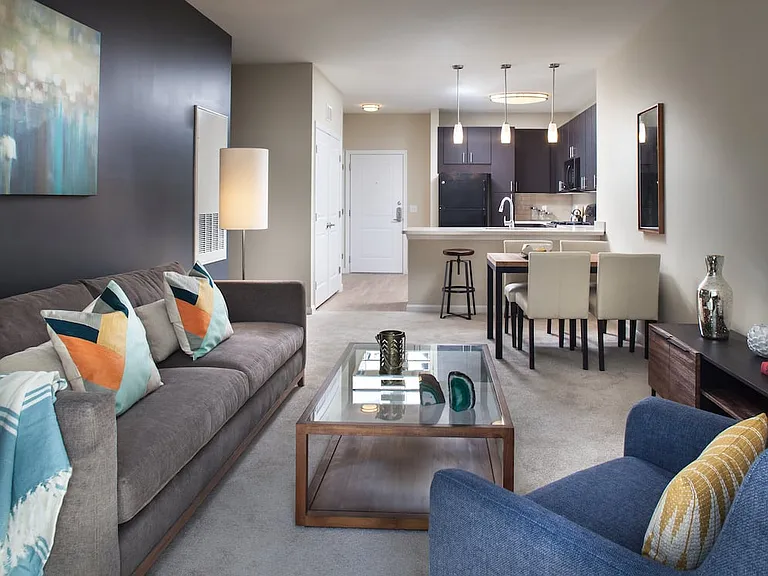 Classic Package kitchen, living, and dining areas with carpet