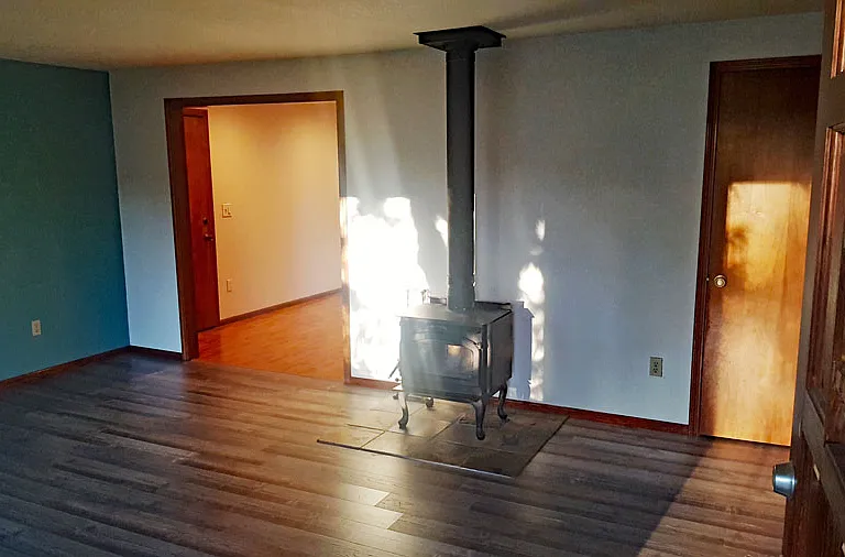 Living room with entrance into dining room