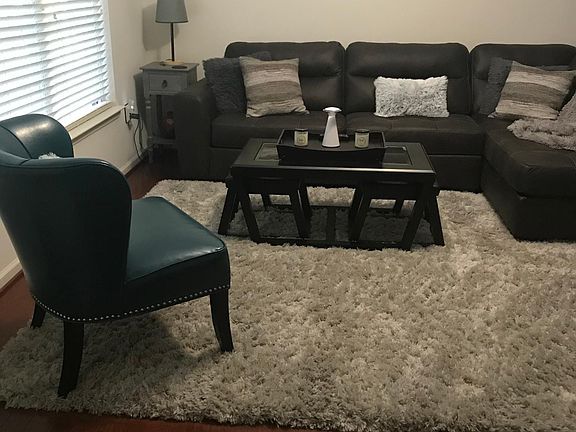 Living Room with Gas Fireplace and Ceiling Fan