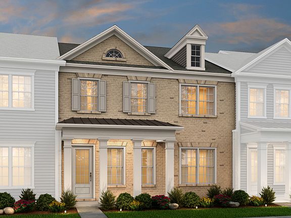 Savannah Exterior 4 features Brick, covered front porch and rear 2 car garage