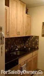 Kitchen
						:
						Elegant tile work, quartz counter-top and stainless steel appliances.