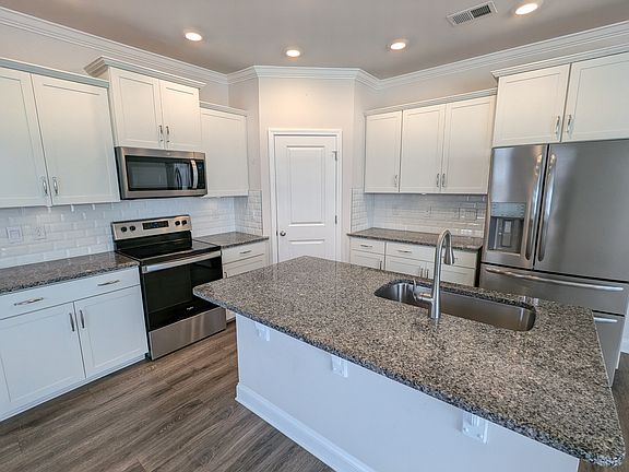 Luxury kitchen with granite countertops and stainless appliances