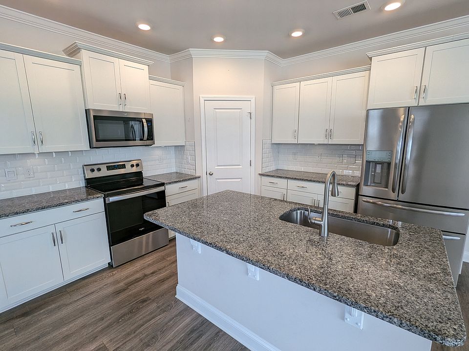 Luxury kitchen with granite countertops and stainless appliances