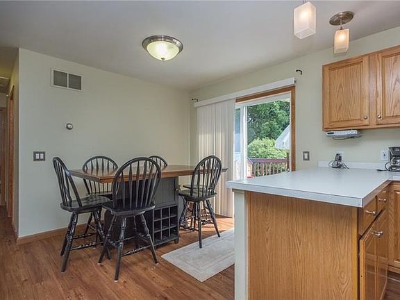 Dining area with slider to the deck.