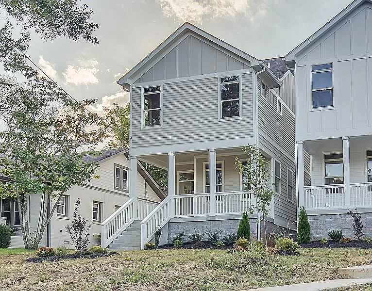 Front of house with front porch, alarm system with keypad door lock and security system.