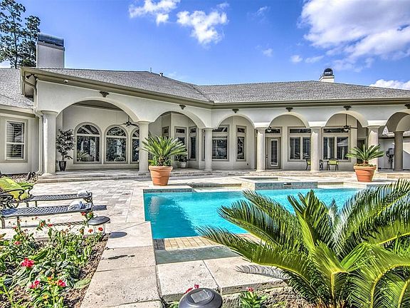 A View From Every Room! HUGE rear patio with walls of windows that let you enjoy the outside on the inside. Plantation Shutters throughout.