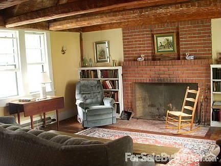 Living Room
						:
						Cathedral ceiling, hand-hewn beams, large fireplace, beautiful lake view