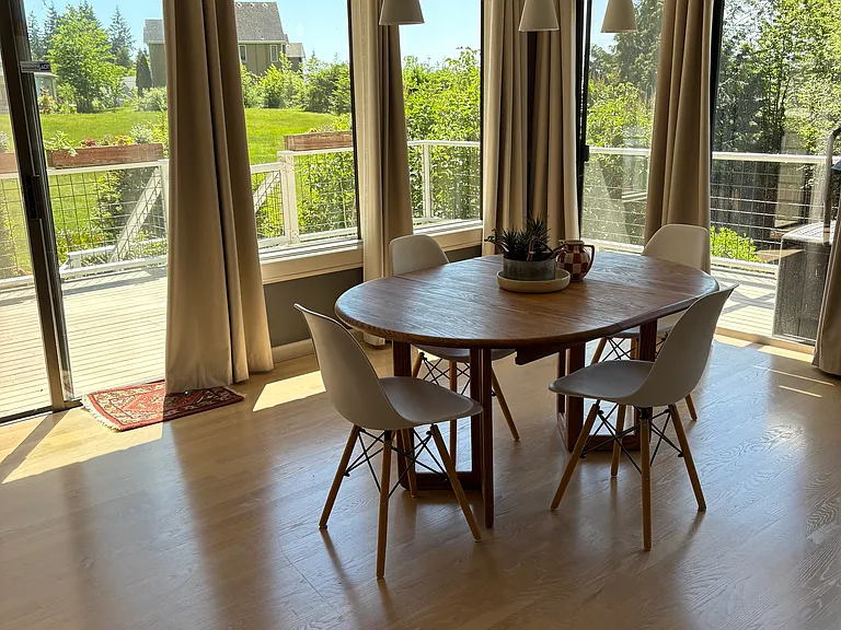 large SW facing dining room with wraparound deck
