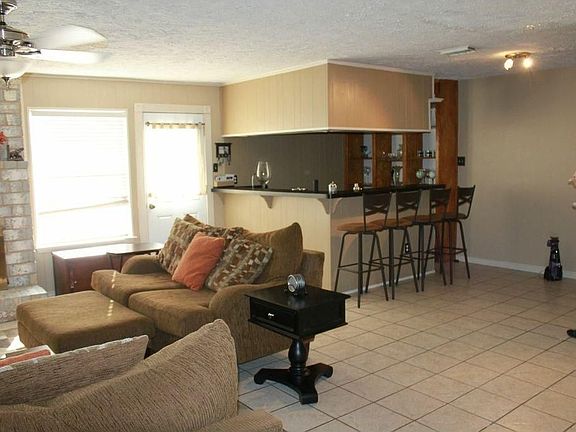 Large family room with breakfast room and wet bar. Great for entertaining.