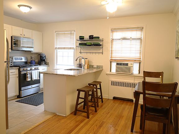 Updated kitchen flowing to the dining room.