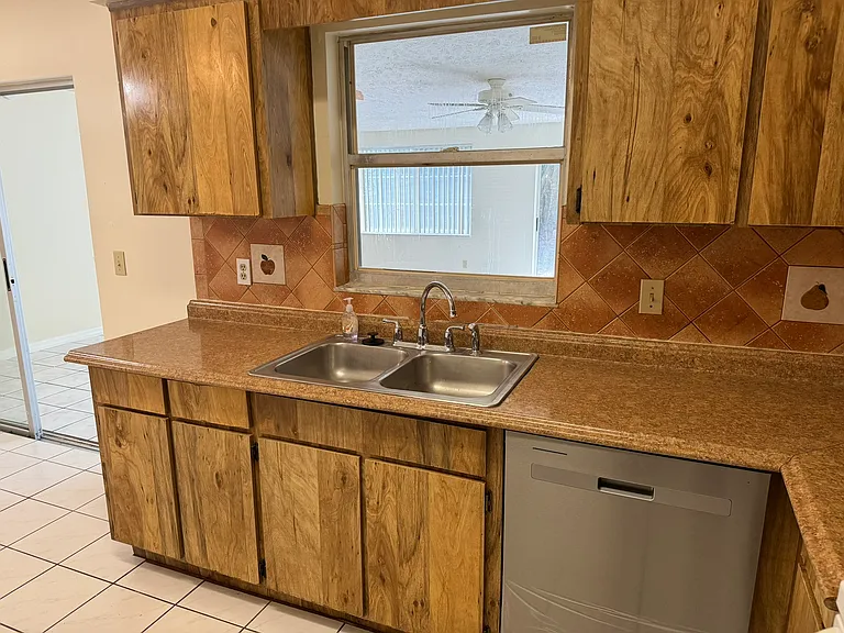 Kitchen with new stainless steel dishwasher