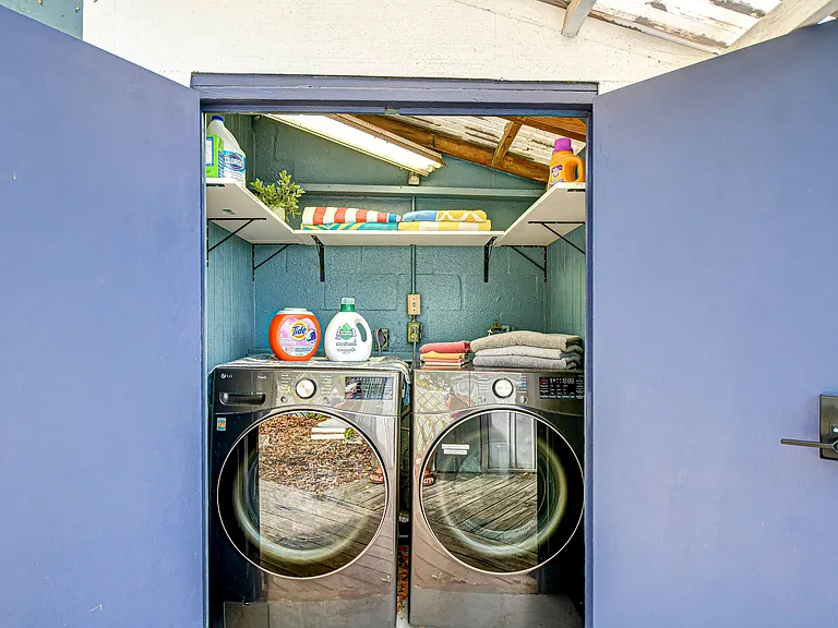 Dedicated laundry room with brand new washer and dryers