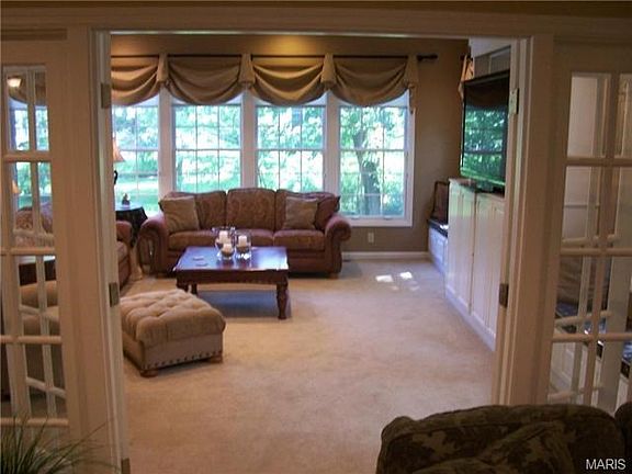 View from hearth room to light-filled great room addition